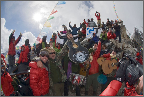 Love Hope Strength founders James Chippendale and Mike Peters celebrate with the rest of the Everest Rocks team after the highest rock concert in the world at 18,536 feet atop Kala Pattar at the foot of Mount Everest, Nepal.